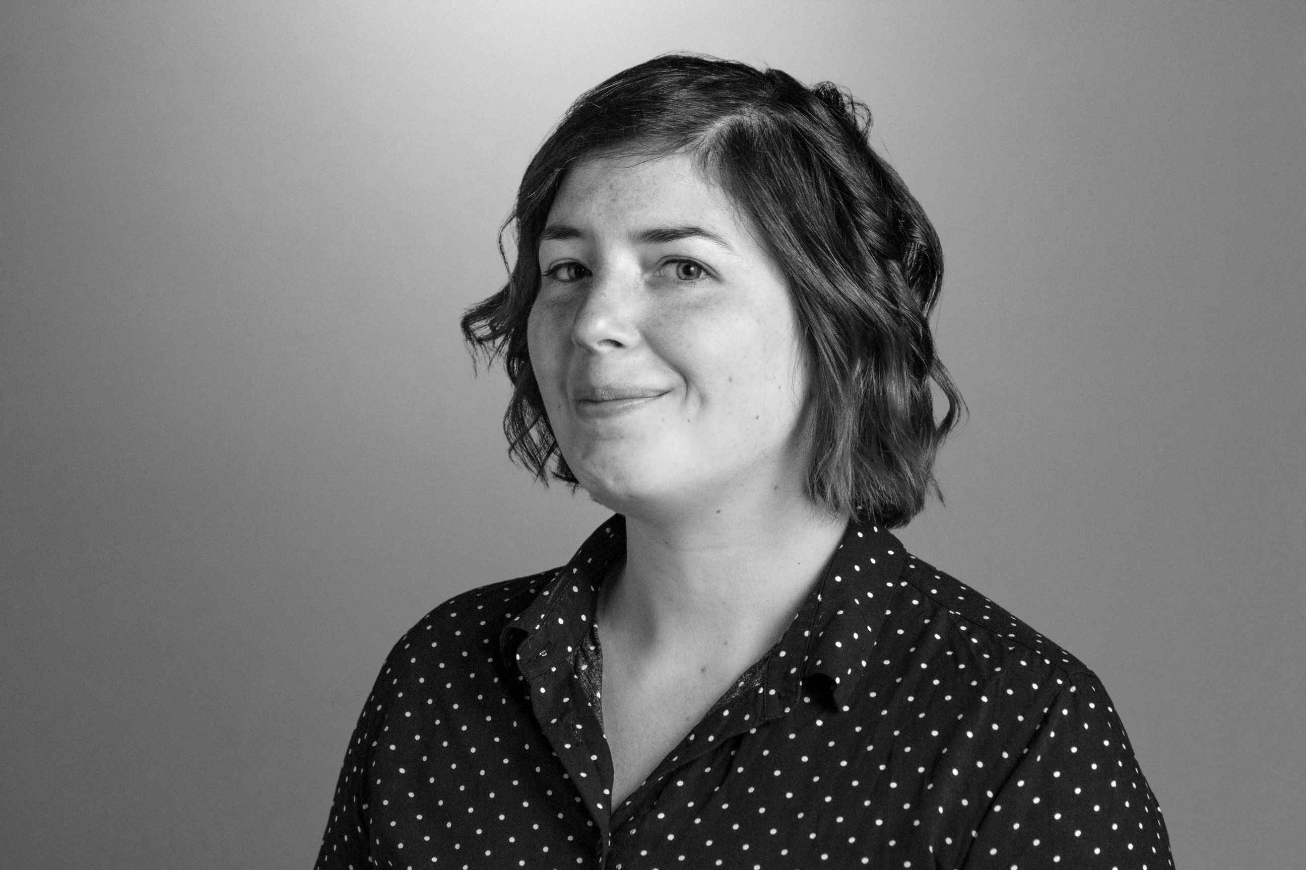 Ash headshot in black and white. 