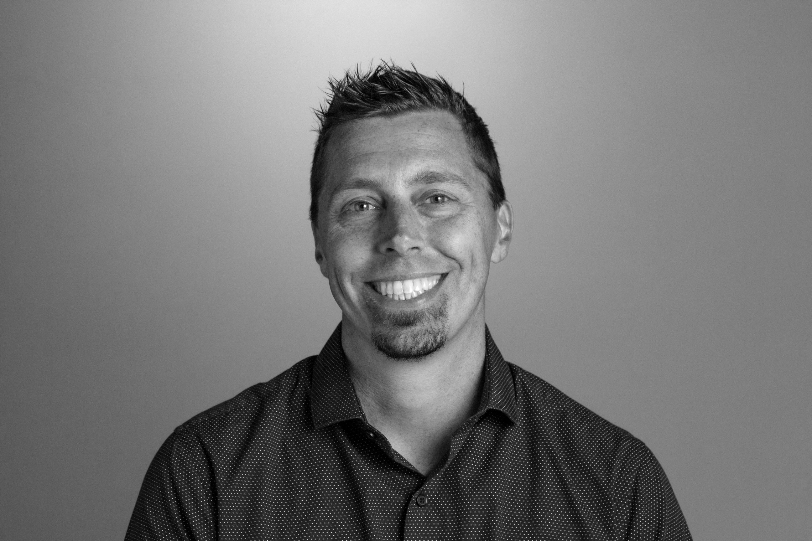 Headshot for Brendan, in black & white. 