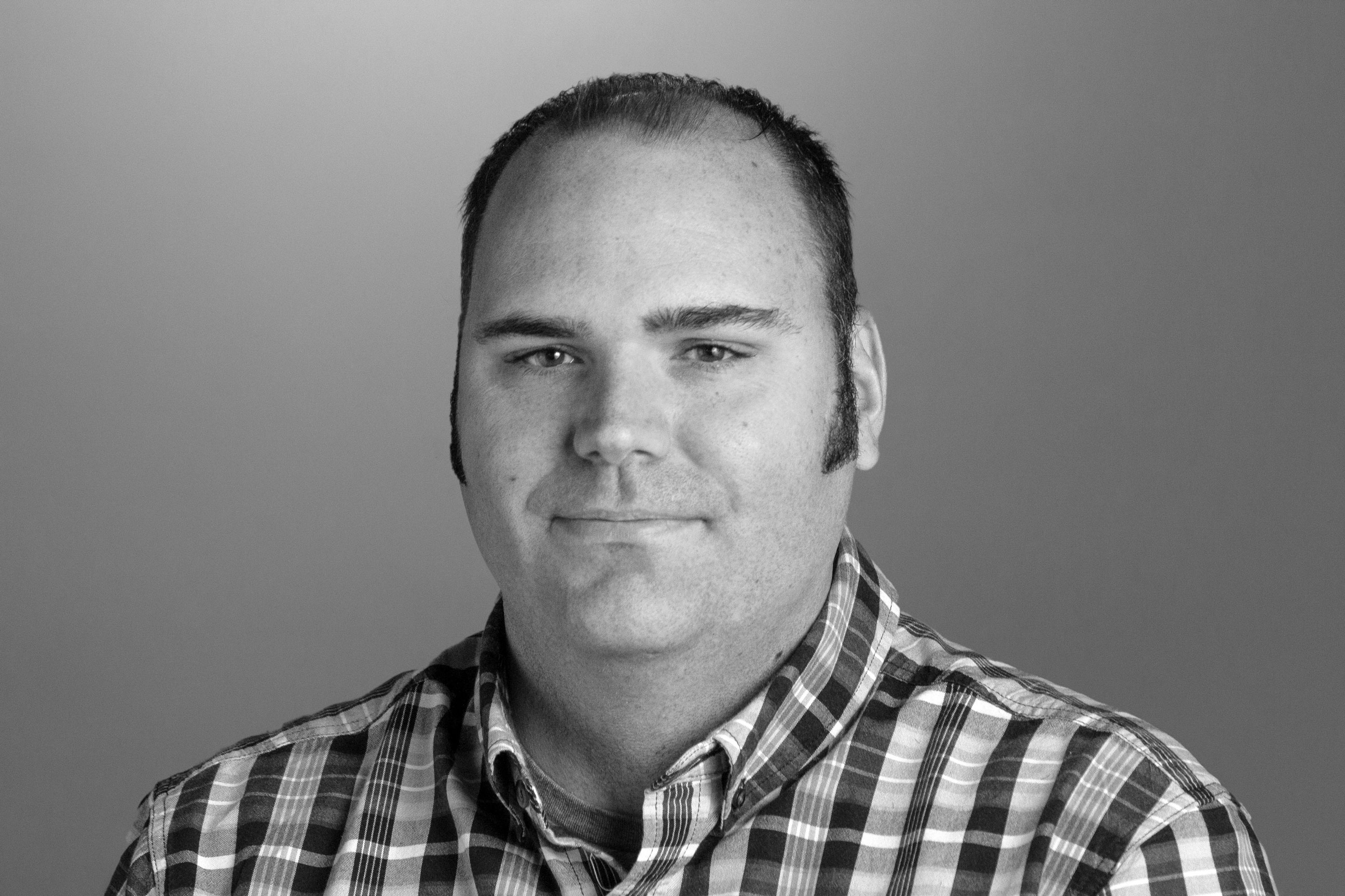 Headshot for Matt in black and white