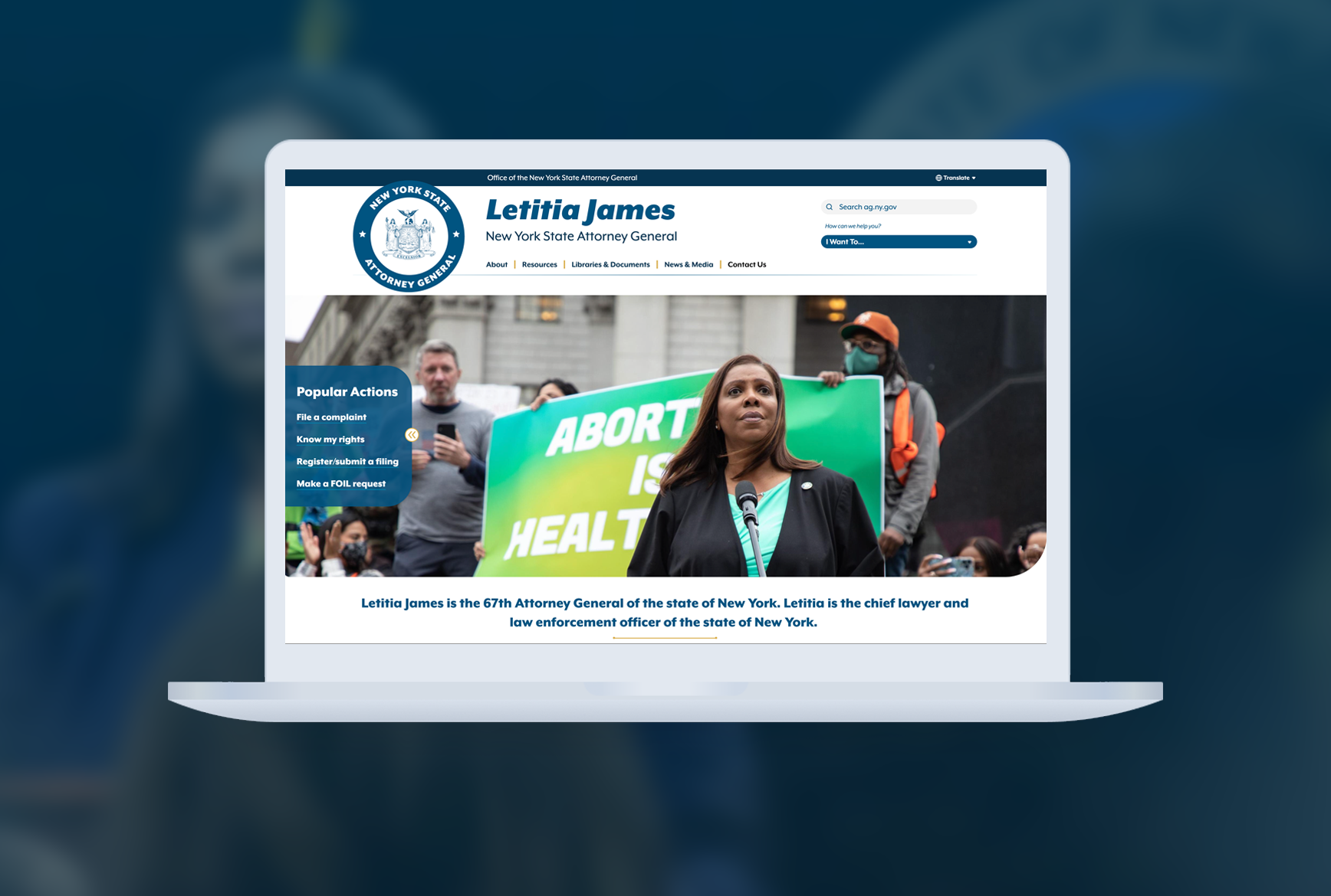 A macbook mockup of the Attorney General website homepage superimposed over an image of AG James. 